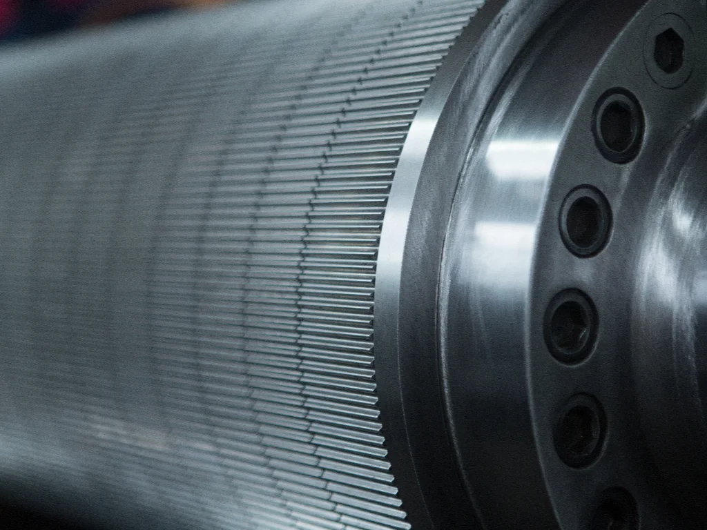 Close-up of a customized tungsten carbide corrugating roll showing fine flute profile and polished end face, designed for high-precision corrugated board production.