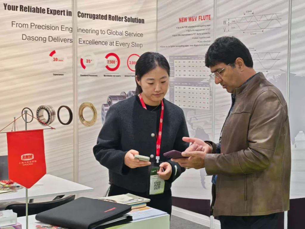 RMM sales representatives discussed corrugated roll solutions with other sales representatives at the trade show.