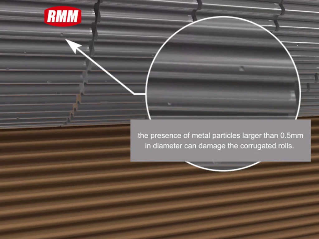 Close-up of corrugating roll surface with highlighted metal particle (illustrating how particles over 0.5mm in diameter damage corrugating rolls)