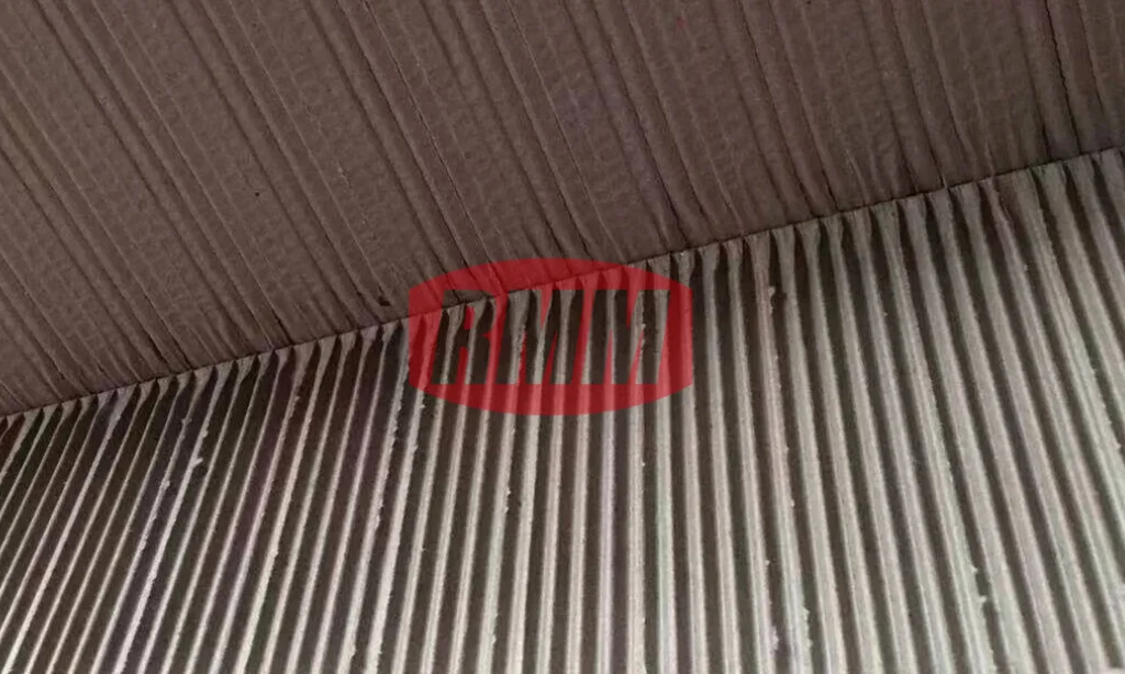 Illustration of flute crushing issues in corrugated board manufacturing