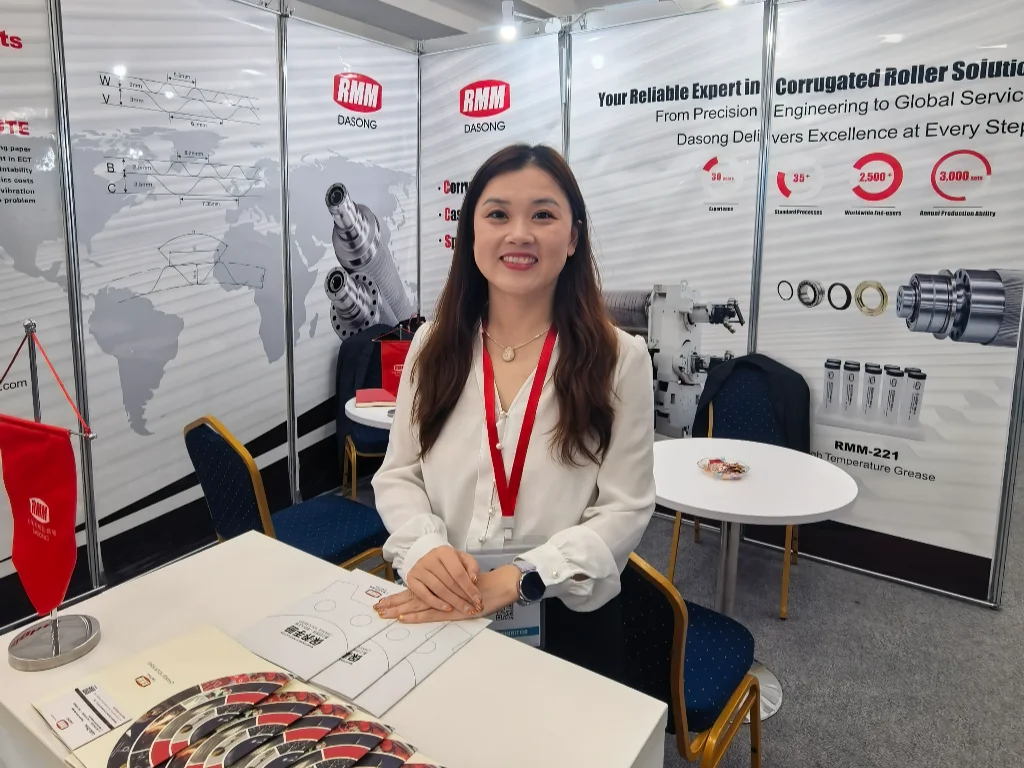 RMM representative at Propack exhibition booth, displaying tungsten carbide corrugated roller solutions.