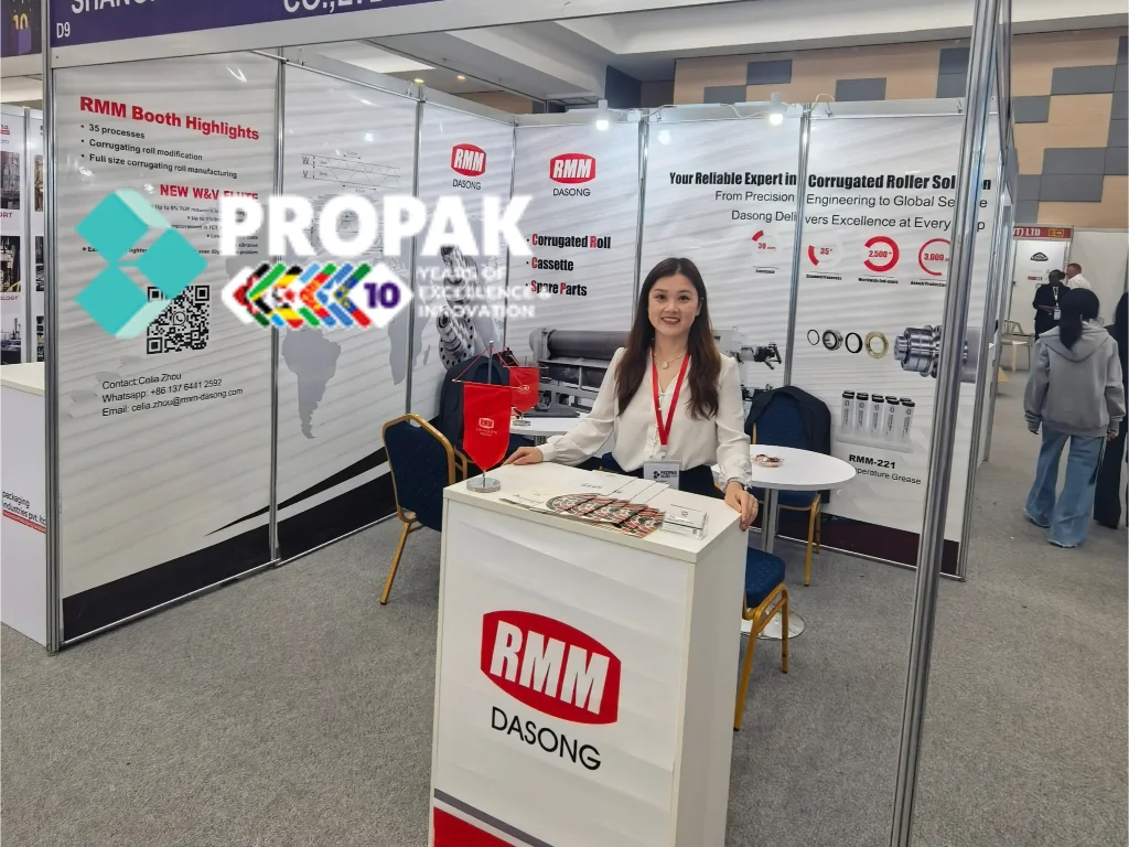 RMM representative at Propack exhibition booth, displaying tungsten carbide corrugated roller solutions.