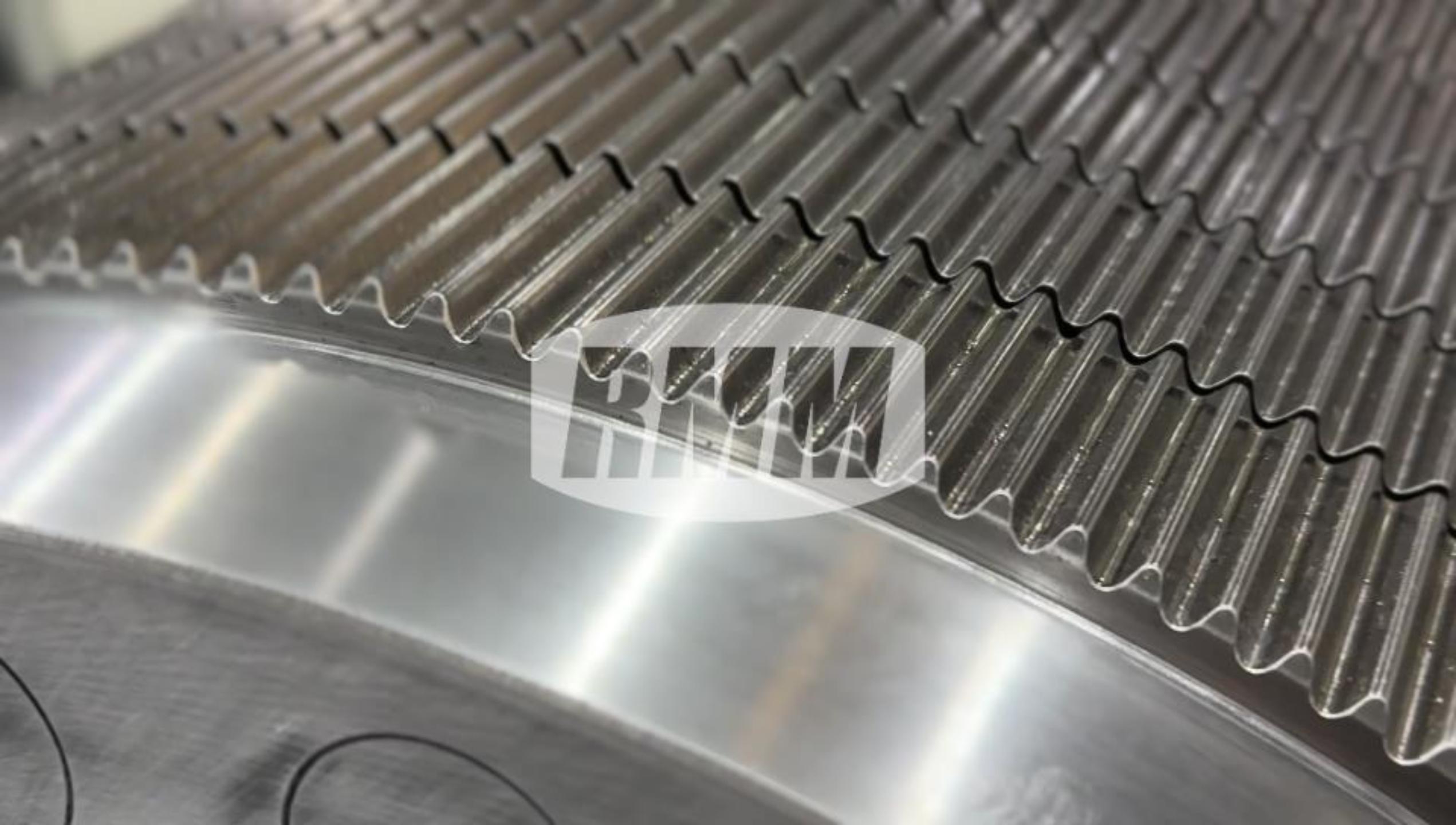 A close-up of a corrugating roll flute profile