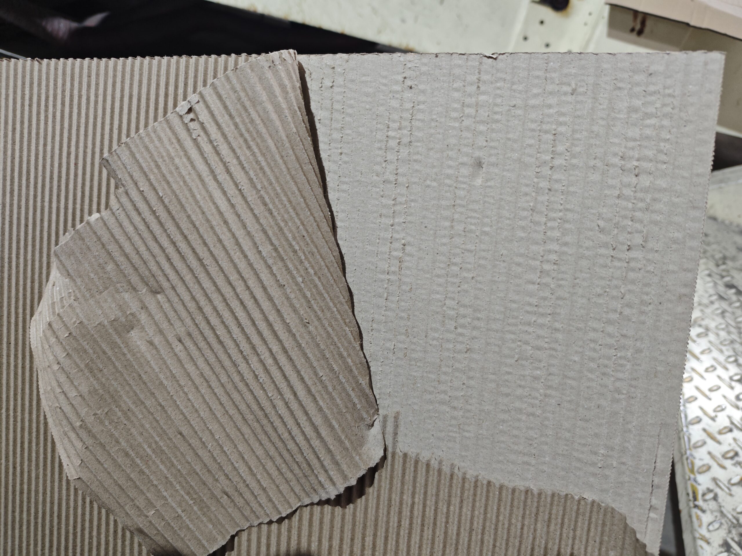 A close-up of a corrugating roll flute profile with a perfect glue line