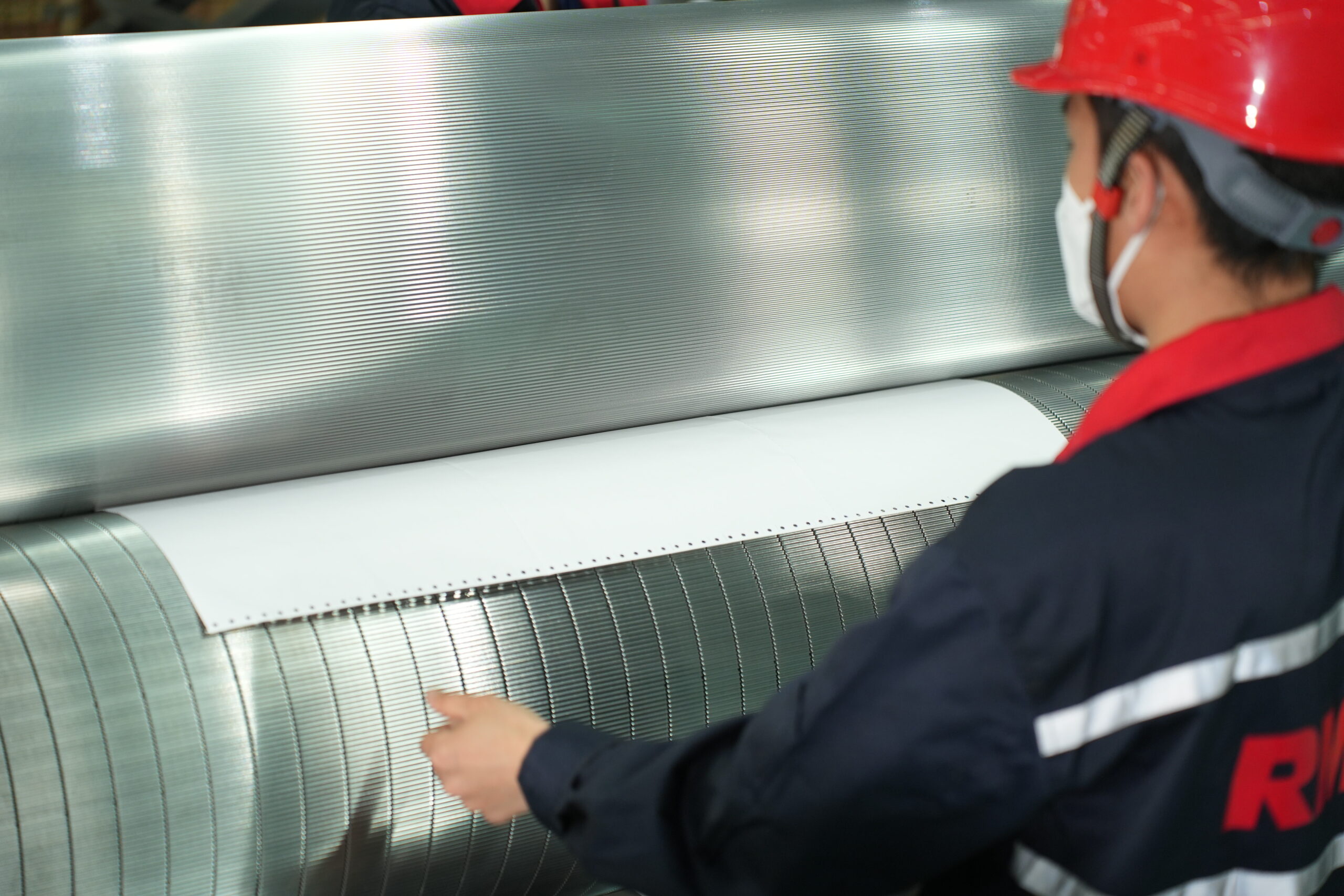 Carbon paper being used to test corrugating rolls