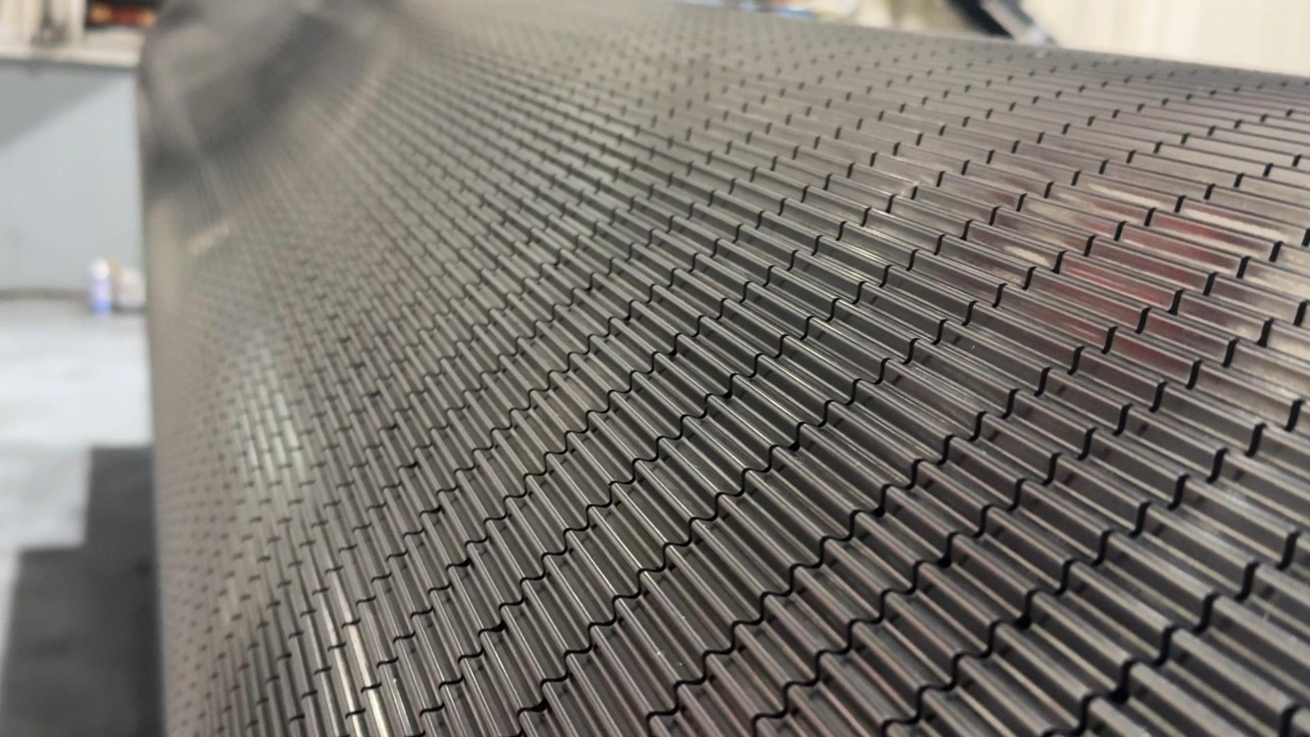 A detailed view of the flute profile on a corrugating roll