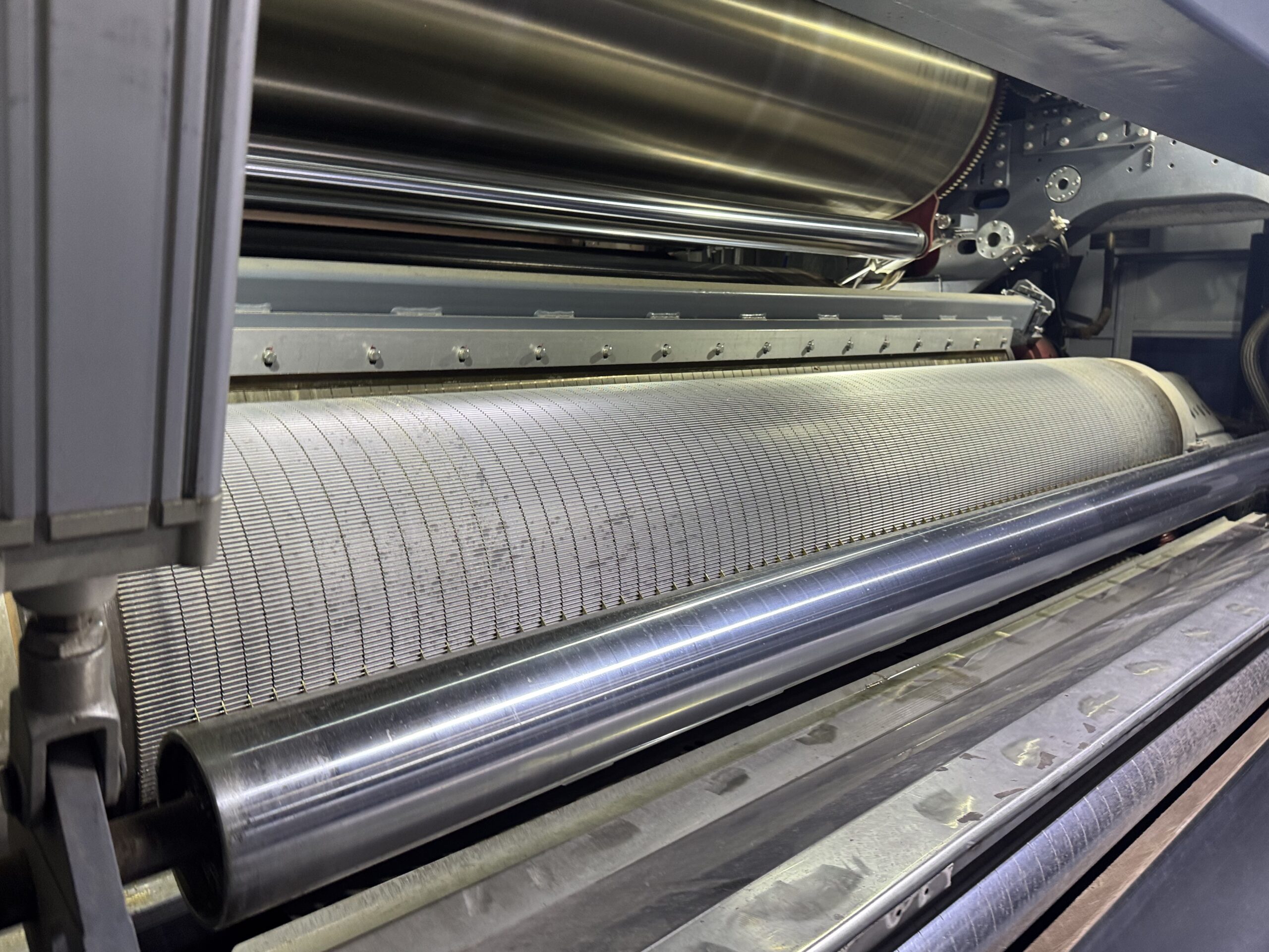 Replacing a corrugating roll A close-up shot of a high-precision single facer